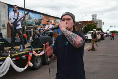 A local band performs on a flatbed trailer during the Fourth of July parade in Brookings, South Dakota.